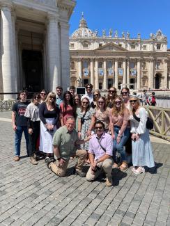 group of students and faculty posing in Rome