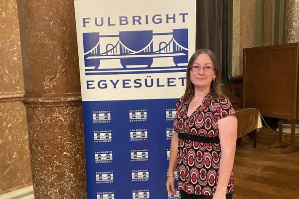 Kathleen Aspiranti in front of Fulbright Sign