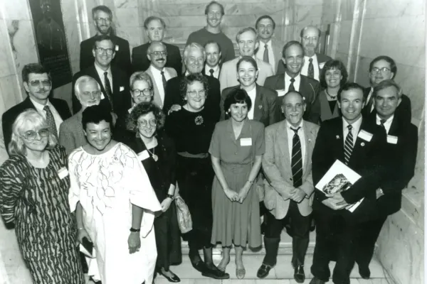 Kentucky Returned Peace Corps Volunteers gathered at the state capitol in 1991. First Peace Corps director Sargent Shriver stands in the middle